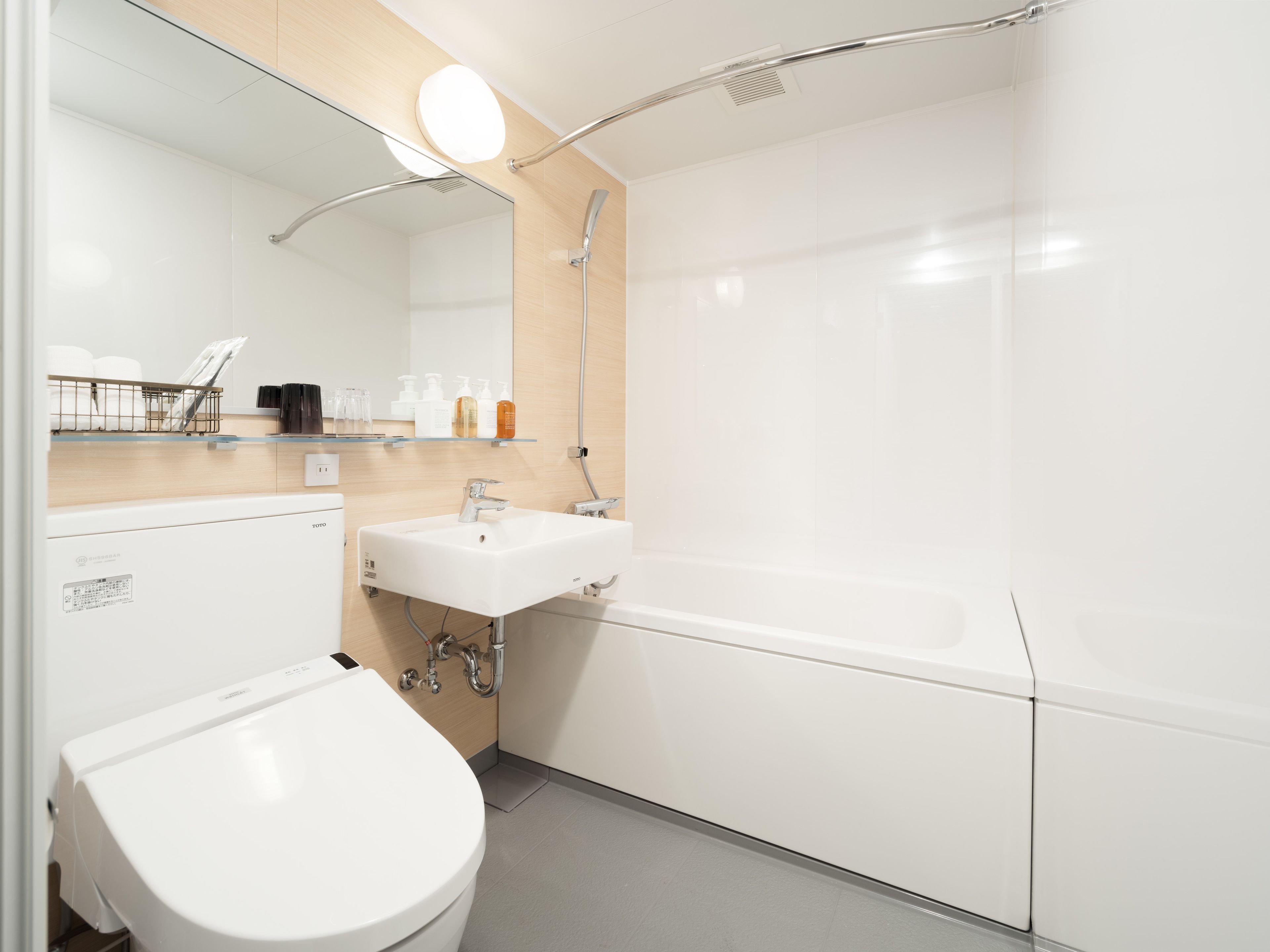 combined shower/bathtub, free toiletries, hair dryer, slippers