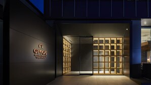 The exterior of a hotel entrance with a modern design, featuring a prominent sign and a well-lit entryway. - OMO5 Tokyo Otsuka by Hoshino Resorts (Tokyo)
