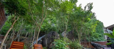 Family Room, Garden View | Minibar, in-room safe, desk, iron/ironing board