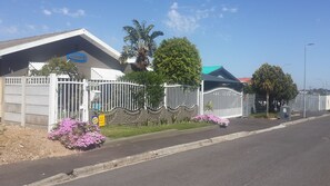 A gated facility with a sign indicating 'Greywater Used' and a contact number for 'Conimita'. - Mitchells Guesthouse (Cape Town)