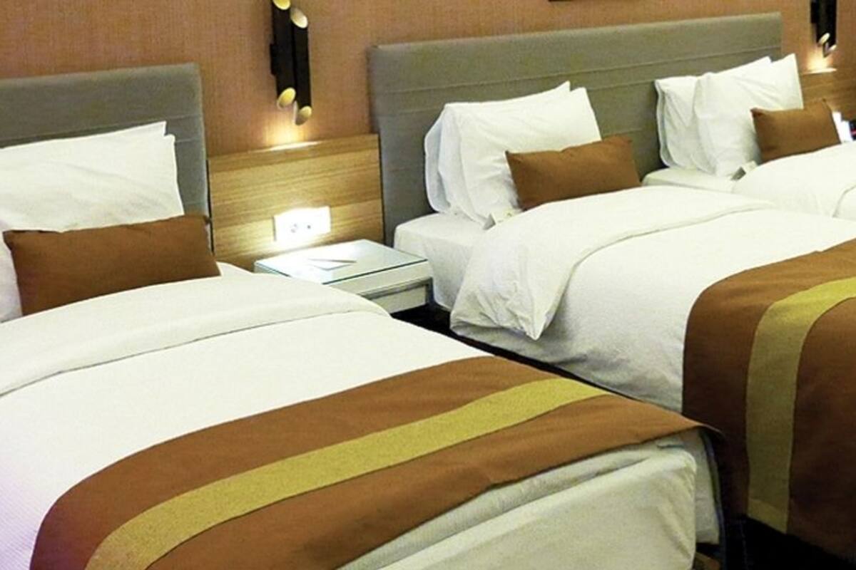Standard Triple Room | Minibar, in-room safe, desk, soundproofing