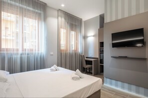 Chambre double ou avec lits jumeaux | Minibar, coffre-fort, bureau, accès au Wi-Fi (inclus)