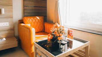Deluxe Room | Living area | Flat-screen TV