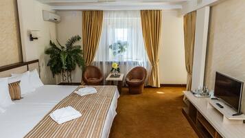 Suite | Minibar, escritorio, tabla de planchar con plancha y camas supletorias