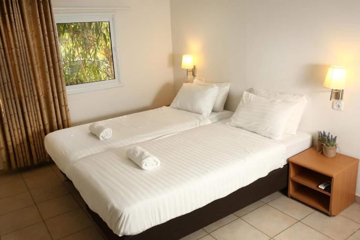 double room, garden area | minibar, in-room safe, desk, blackout curtains