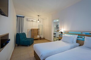 Family Room | Minibar, in-room safe, desk, blackout drapes - Kibbutz Hotel Eilot Country Lodging (Hevel Eilot)