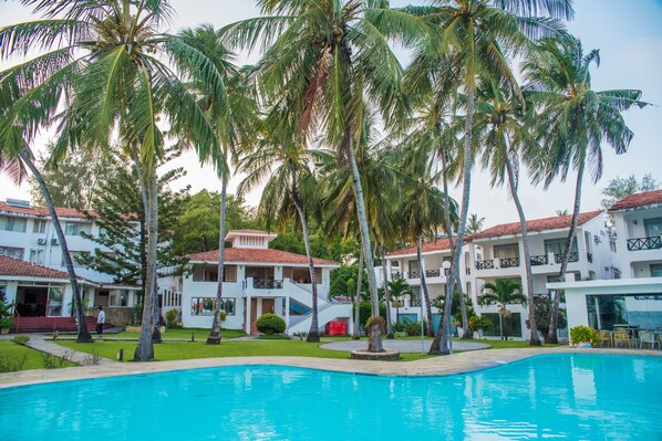 Outdoor pool, open 5 AM to 6 PM, pool umbrellas, pool loungers