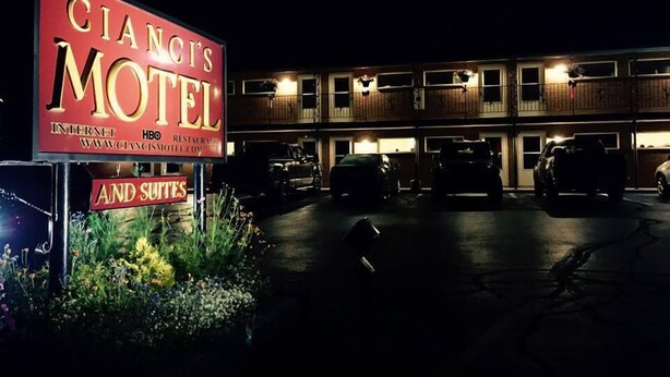 A motel with a large sign advertising 'CIANCIS MOTEL' and 'AND SUITES'. - Cianci's Motel and Suites (Greenville)