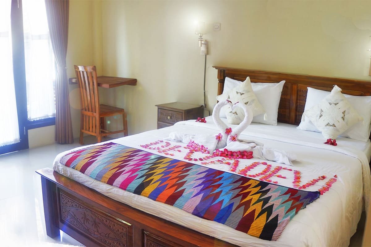 Deluxe Room, Patio | In-room safe, desk, laptop workspace, soundproofing