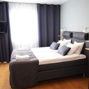 Desk, laptop workspace, blackout curtains, iron/ironing board