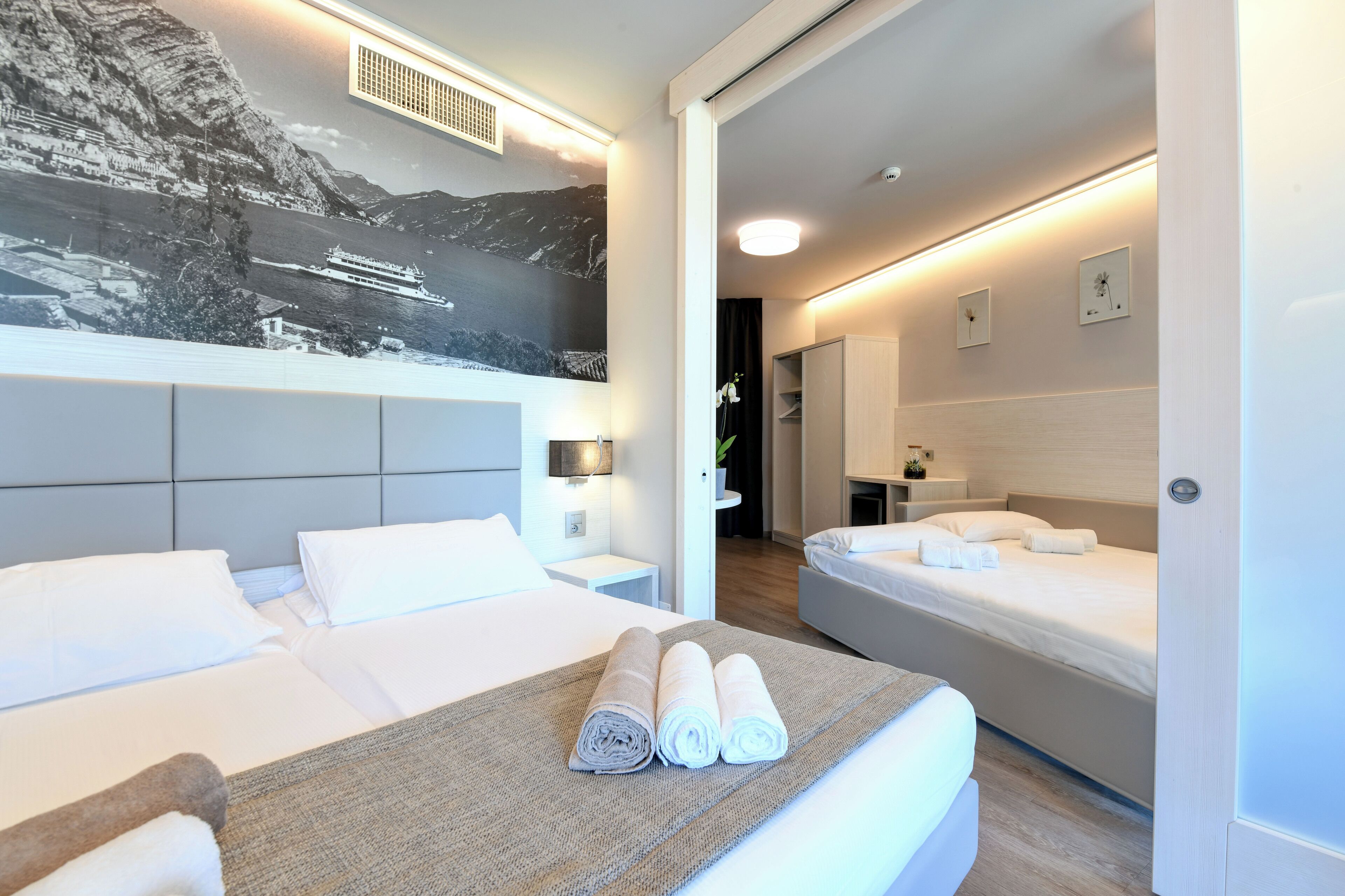 family suite, balcony, partial lake view | in-room safe, desk, laptop workspace, soundproofing