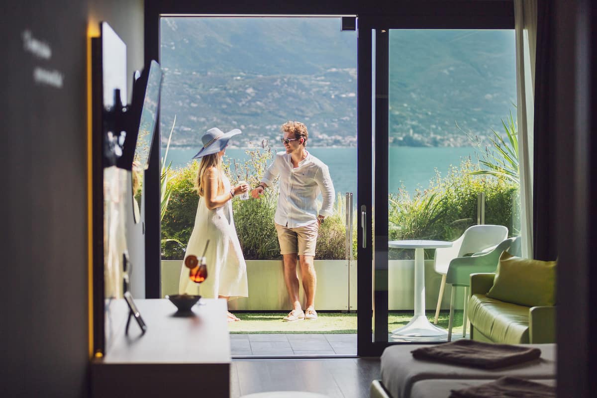 deluxe twin room, balcony, lake view | in-room safe, desk, laptop workspace, soundproofing