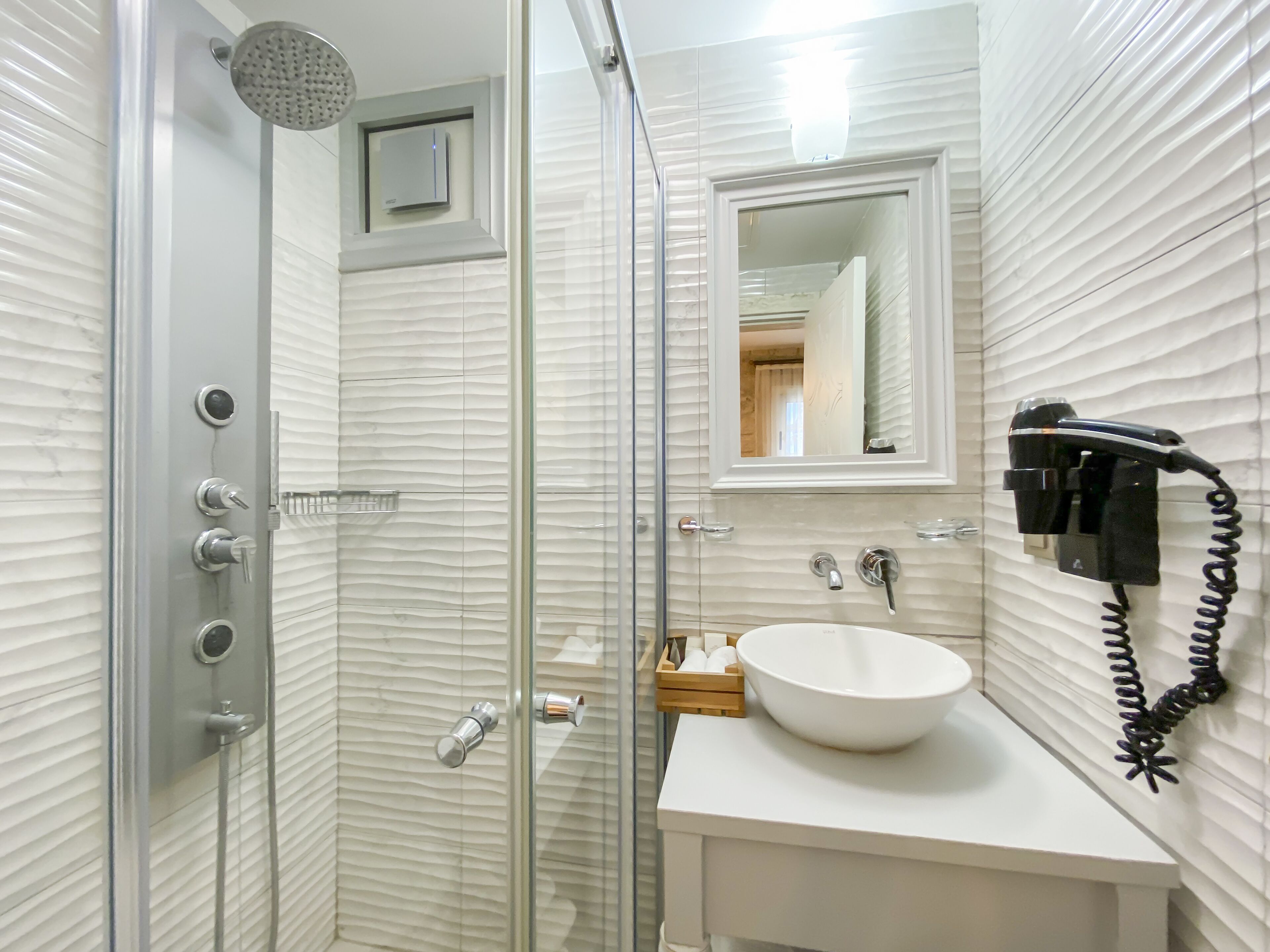 shower, free toiletries, hair dryer, slippers