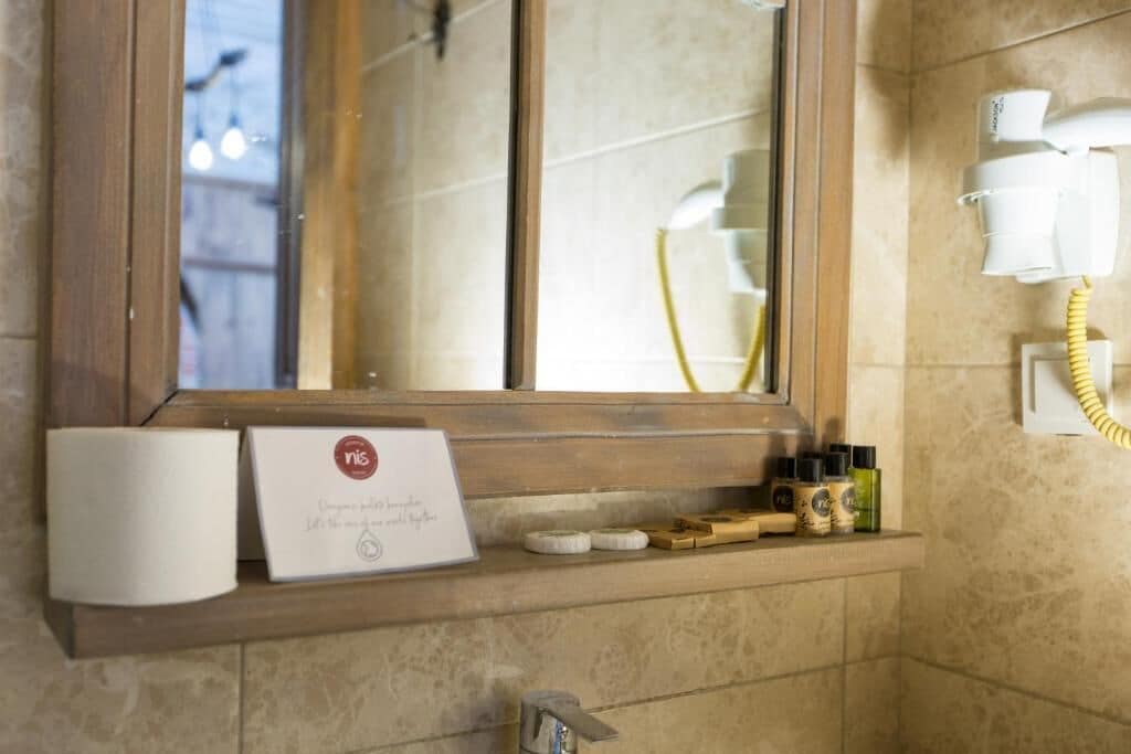 economy double room | bathroom | shower, free toiletries, hair dryer, slippers