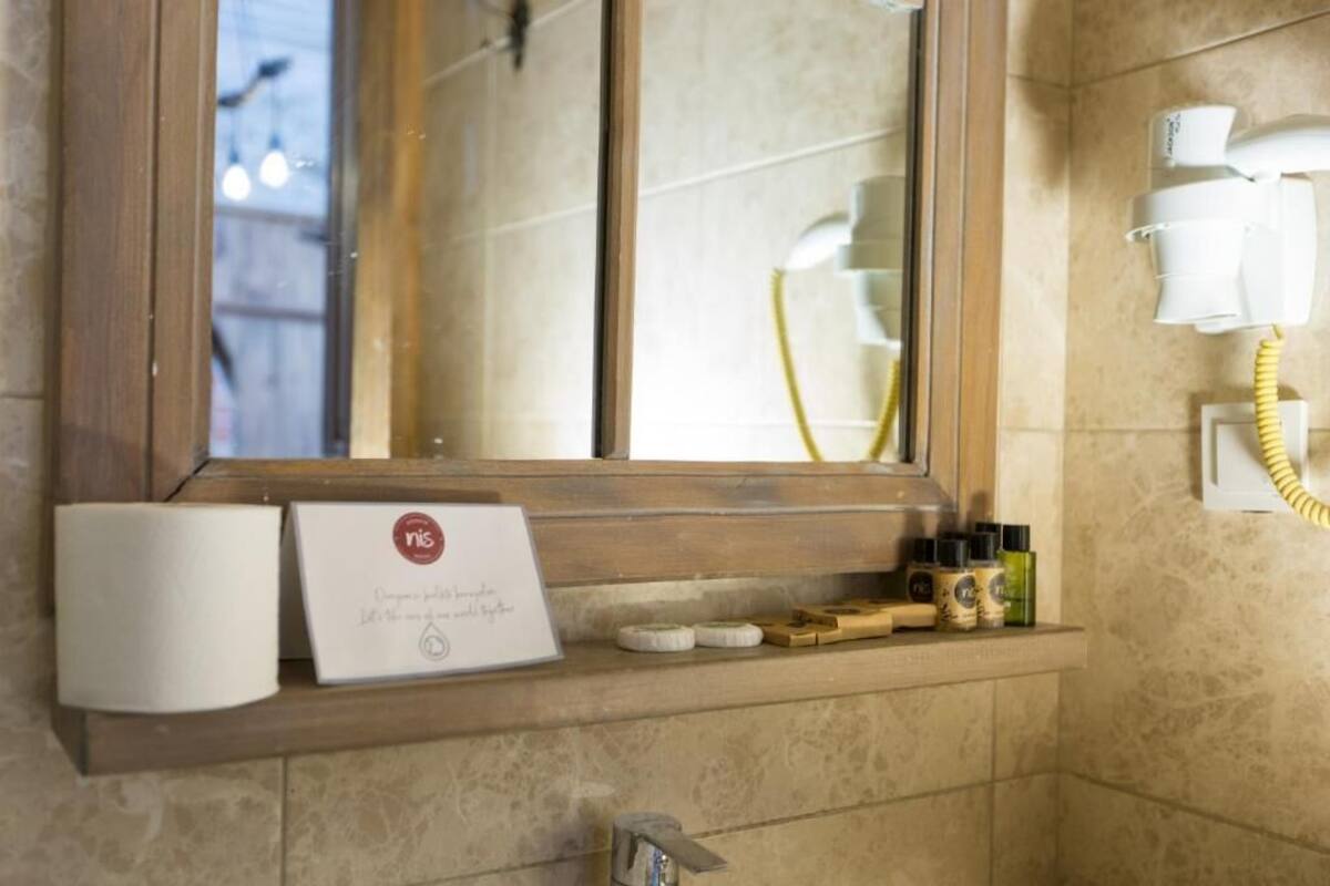 economy double room | bathroom | shower, free toiletries, hair dryer, slippers