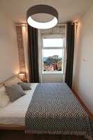 Comfort Apartment, 1 Bedroom, Patio, Sea View | Iron/ironing board, free cribs/infant beds, free WiFi, bed sheets