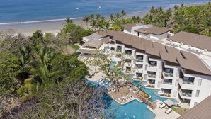 A resort with a pool, beach, and ocean view. - Azura Beach Resort - All Inclusive - Adults Only (Sámara)