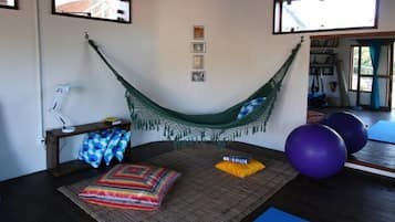 Relax in comfort with a hammock, bed, and exercise space.