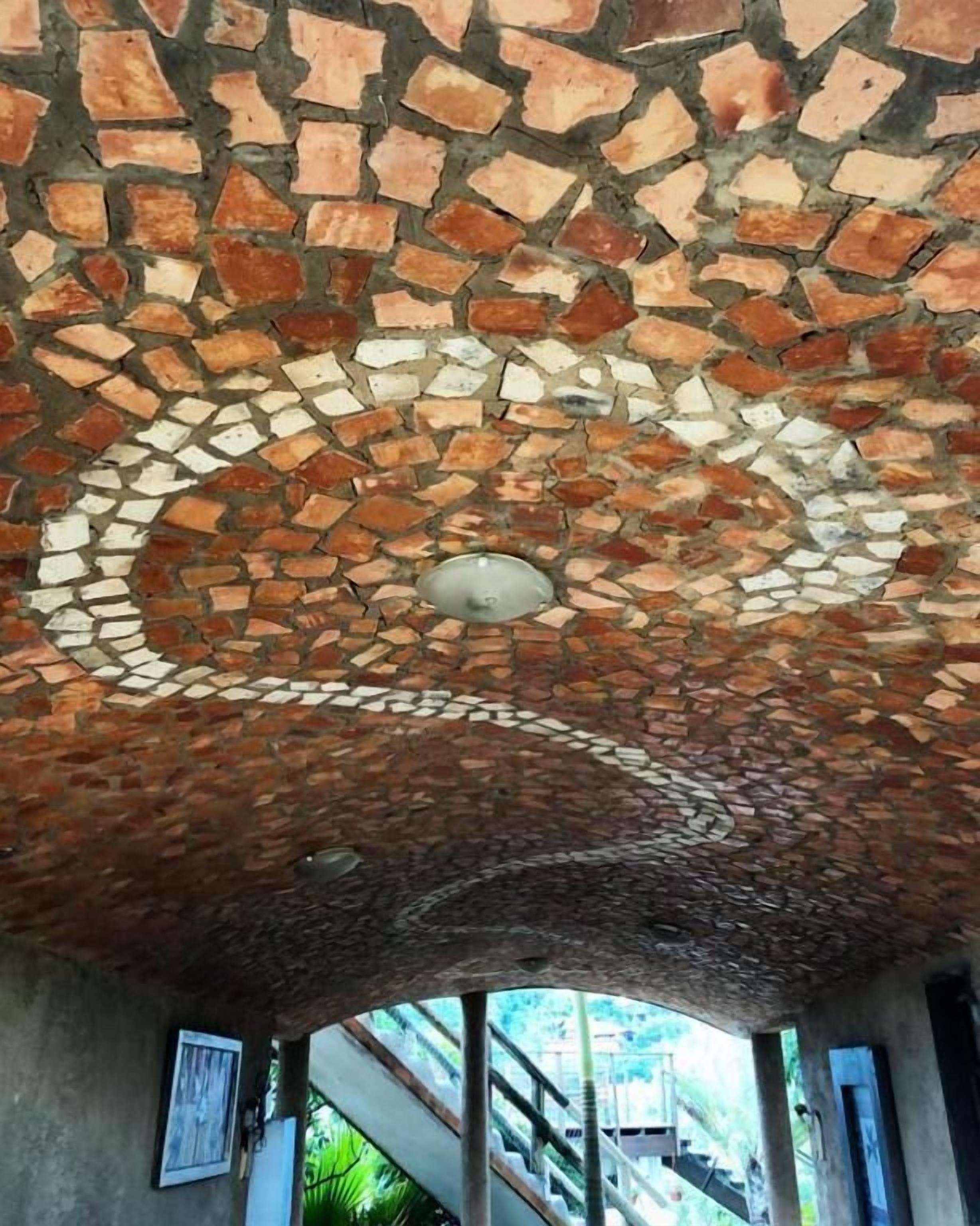 A ceiling with a mosaic pattern.