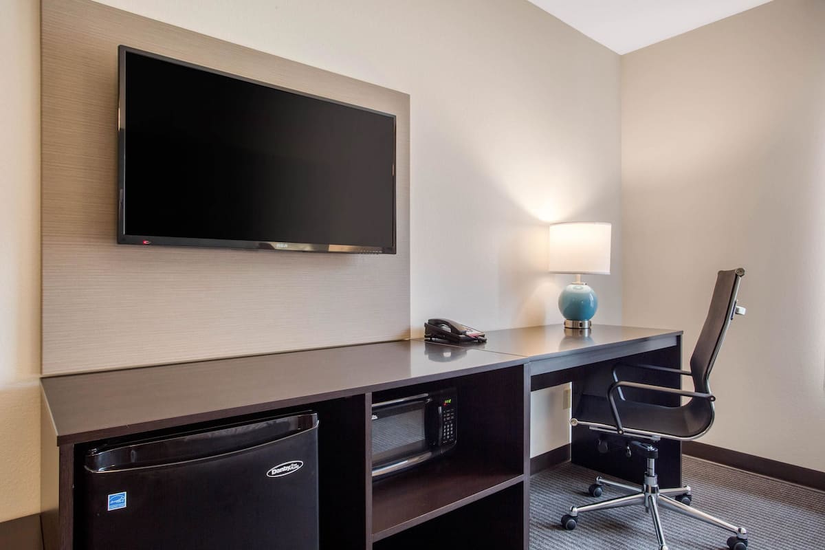 suite, 1 king bed, non smoking | desk, laptop workspace, blackout curtains, iron/ironing board