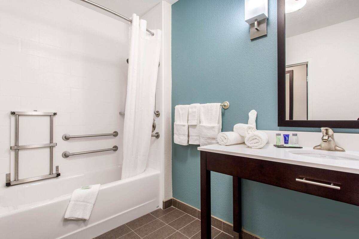 desk, laptop workspace, blackout curtains, iron/ironing board