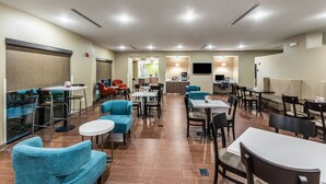 A hotel lobby with seating areas, a reception desk, and a kitchenette. - Sleep Inn & Suites Fort Worth - Fossil Creek (Fort Worth)