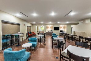Relax and socialize in this inviting space with comfortable seating options and amenities for entertainment.