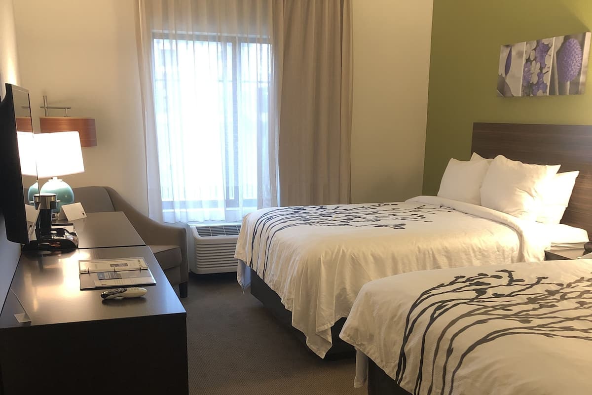 Pillow-top beds, desk, laptop workspace, blackout curtains