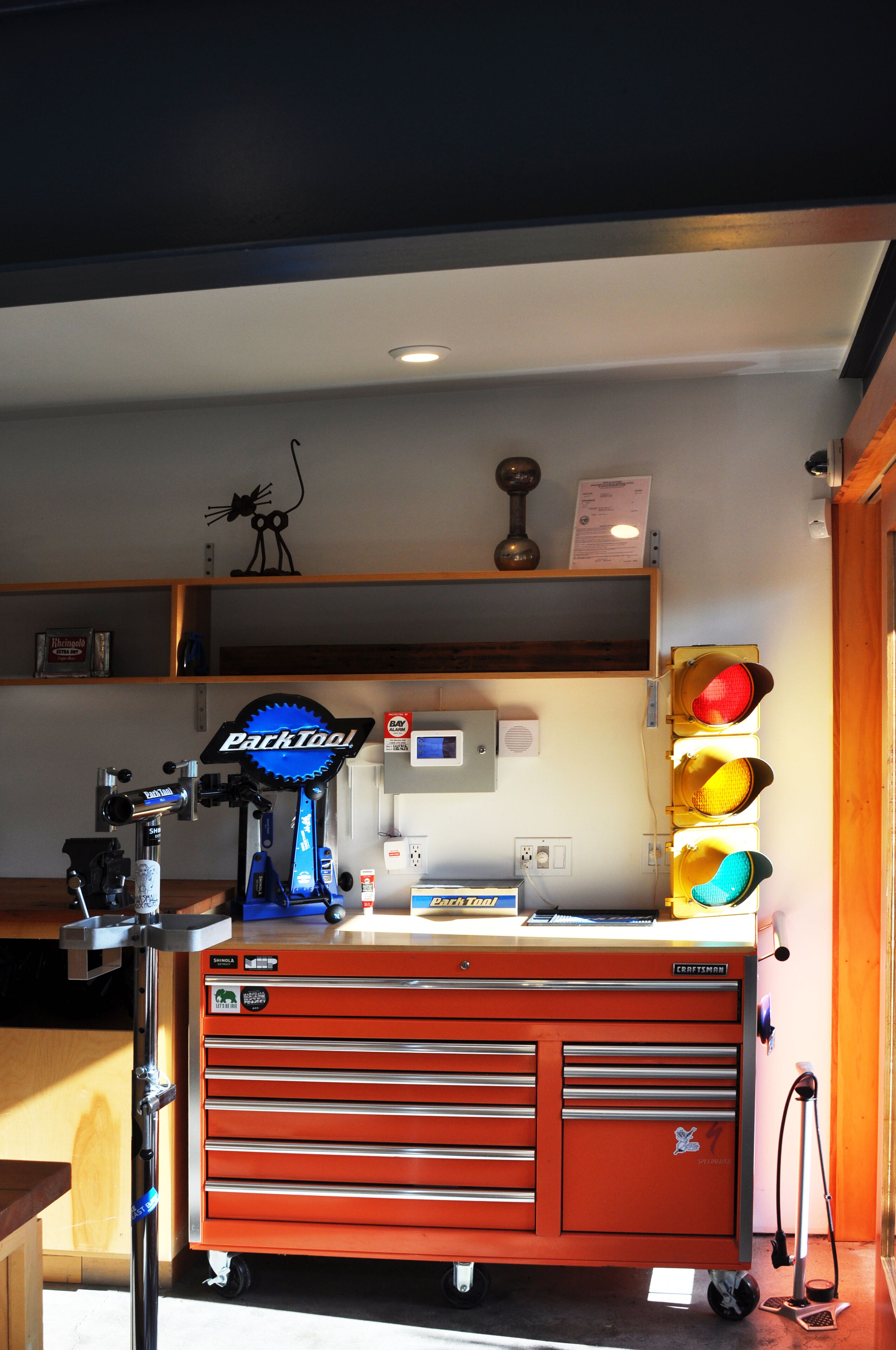 A workshop with a red workbench, tools, and a sign that reads "Parktool."