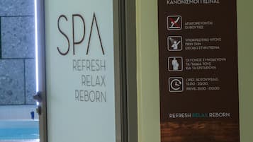 A spa pool sign with operating hours and a glass door labeled "SPA REFRESH RELAX REBORN".