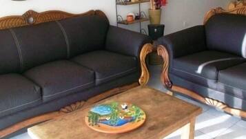 Family Condo, 2 Bedrooms, Ocean View, Beachfront | Living area | Flat-screen TV