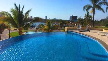 Outdoor pool, open 9 AM to 9 PM, pool loungers