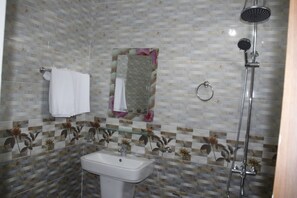 Shower, free toiletries, slippers, towels