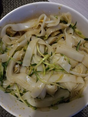A bowl of noodles with vegetables. - Beijing Badaling Great Wall Caos Hostel (Yanqing)