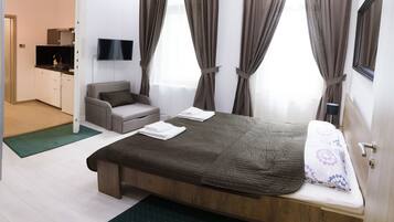 Apartamento, 1 quarto (Downtown 2) | 1 quarto, cortinas blackout, ferros/tábuas de passar roupa