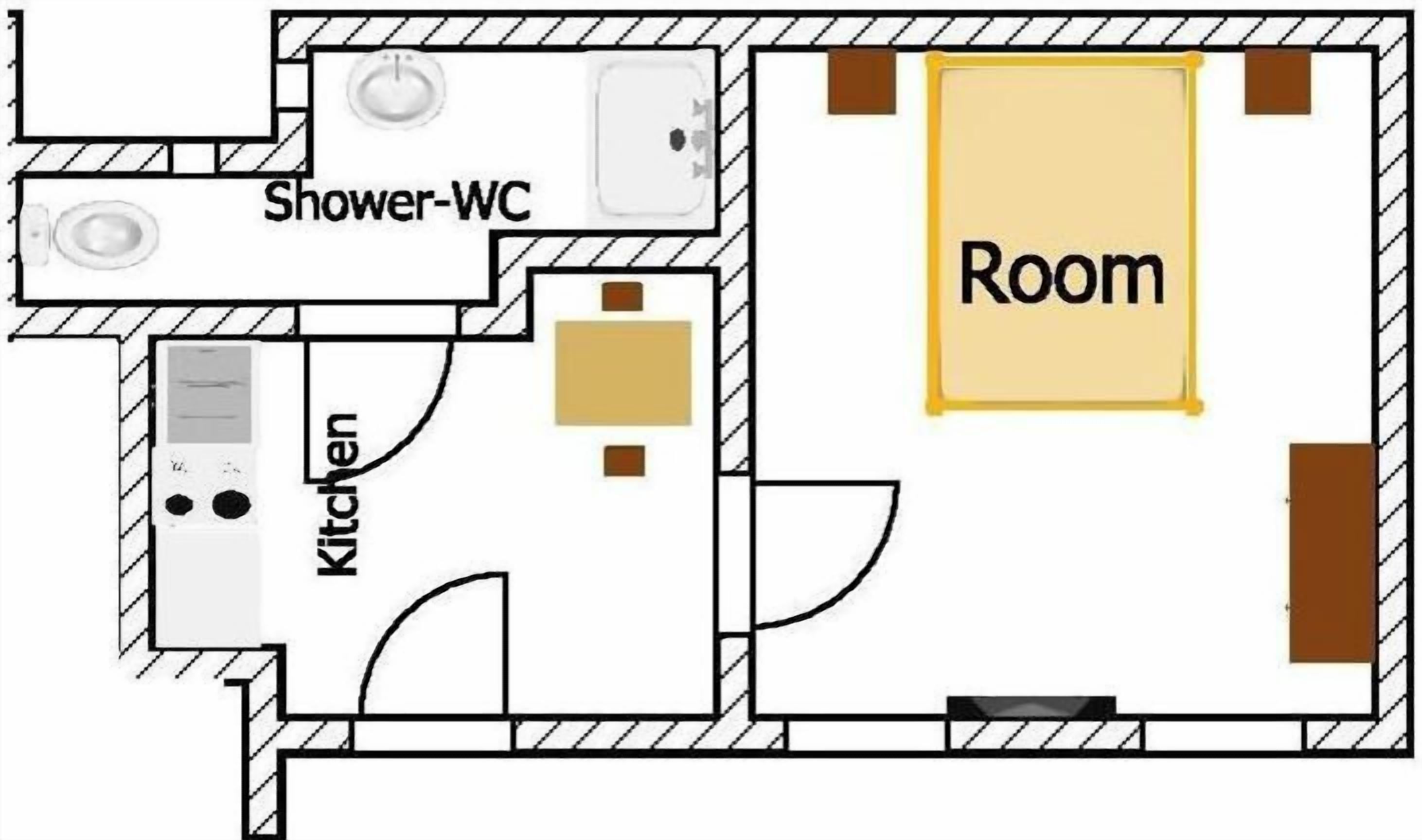 Un plan d’étage comprenant une douche, des toilettes, une cuisine et une grande pièce.