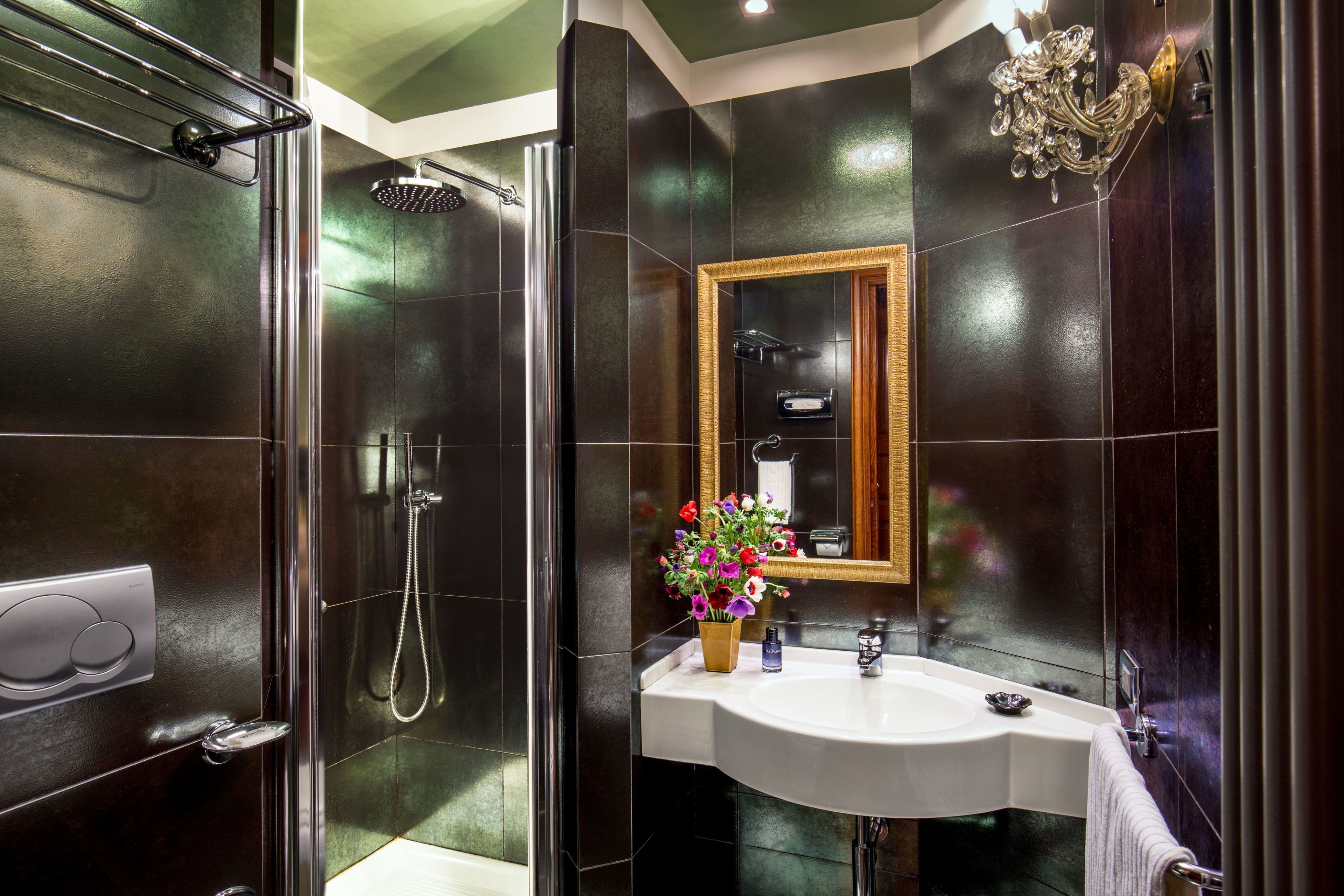 deluxe room | bathroom | shower, free toiletries, hair dryer, slippers