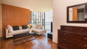 A modern living room with a sofa, coffee table, and a dresser. - Villa Xilaiwan (Ratsada)