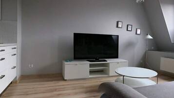 Suite Studio Ville | Coin séjour | Télévision à écran plat