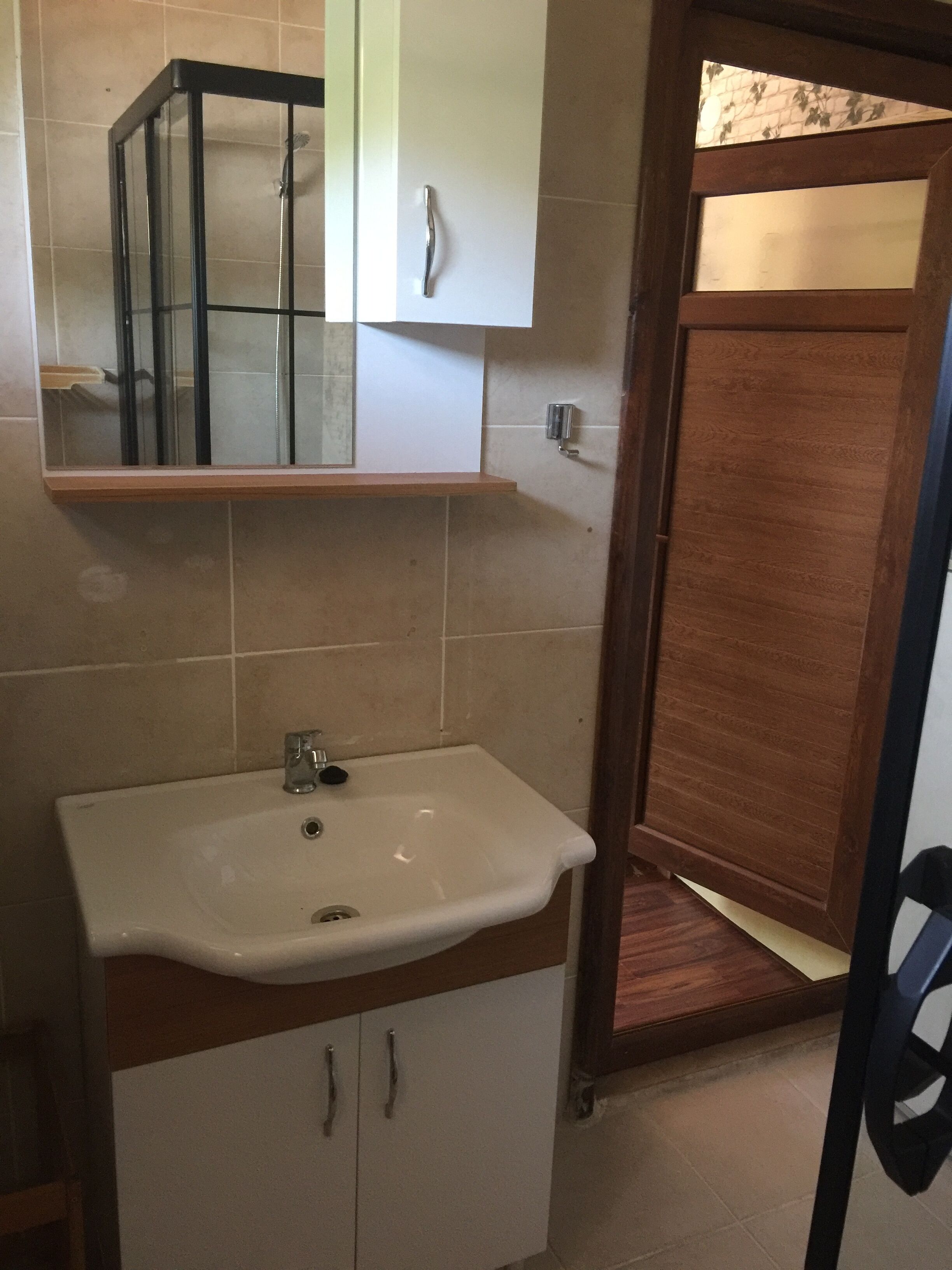 junior studio, garden view | bathroom | shower, rainfall showerhead, hair dryer, slippers