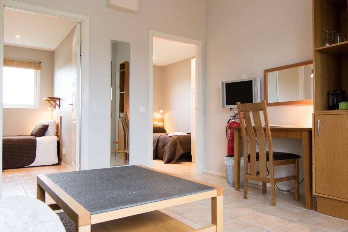 standard suite, 2 bedrooms | living room | 40-inch flat-screen tv with digital channels, tv