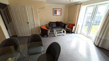 Family House, 3 Bedrooms | Living area | Flat-screen TV