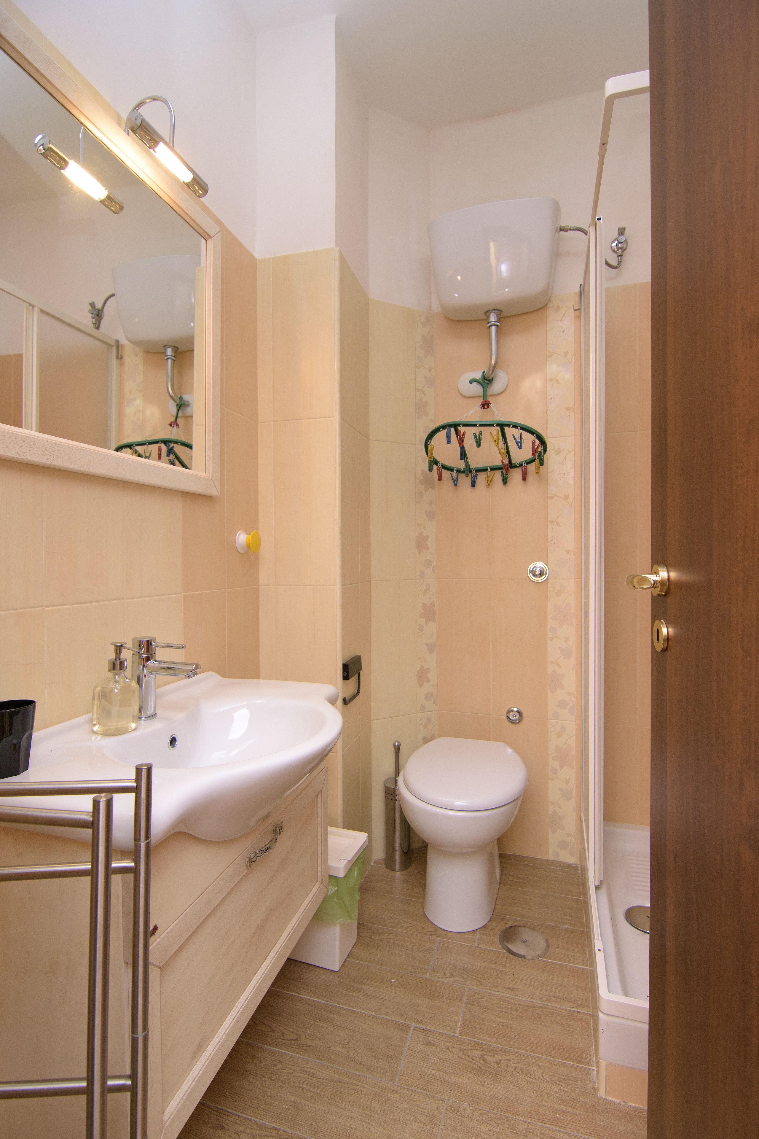 A bathroom with a sink, toilet, and shower.