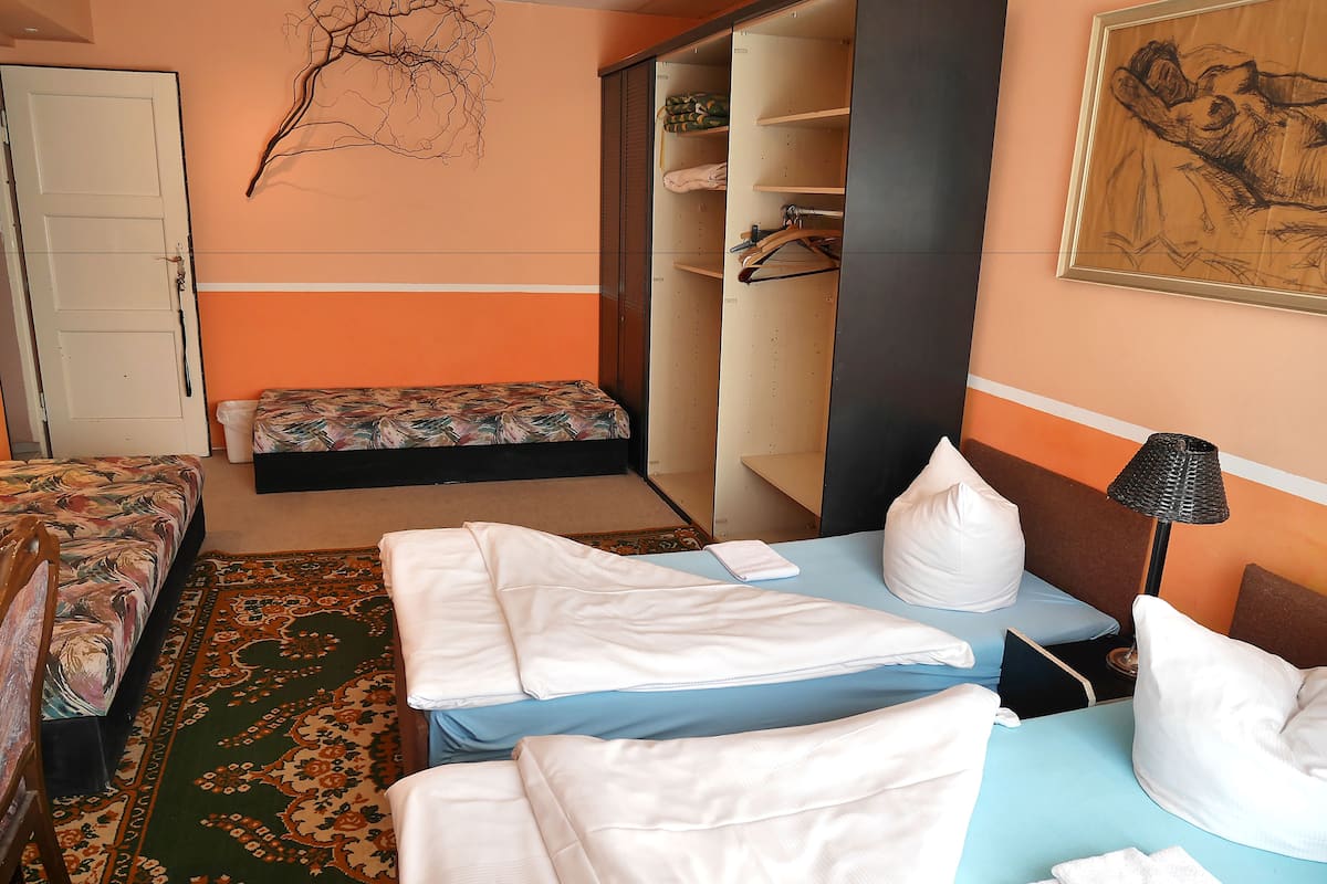 Quadruple Room | Desk, blackout drapes, iron/ironing board, rollaway beds