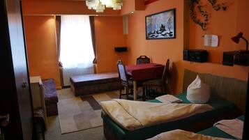 Desk, blackout drapes, iron/ironing board, rollaway beds