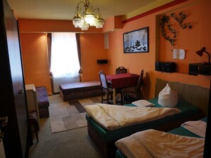 Desk, blackout curtains, iron/ironing board, rollaway beds