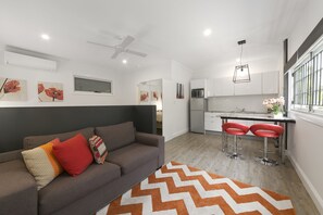 Studio | Living area | 33-inch flat-screen TV with digital channels, TV, DVD player