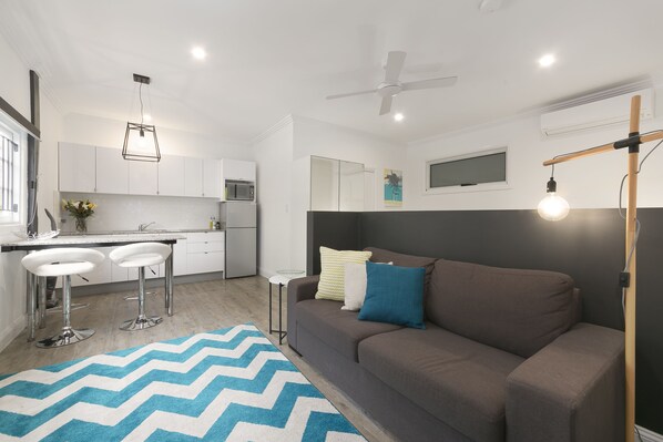 Studio | Living area | 33-inch flat-screen TV with digital channels, TV, DVD player