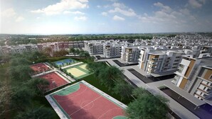 A residential area with apartment buildings, green spaces, and sports courts. - Quin Homestay (Kota Kinabalu)