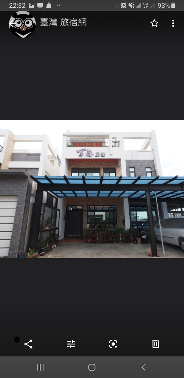 A modern building with a covered entrance and a sign that reads "Hotel". - Passion B&B (Magong)
